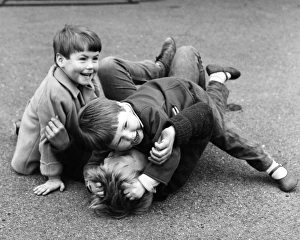 Three boys mock fighting, Balham, SW London Three boys mock fighting, Balham, SW London