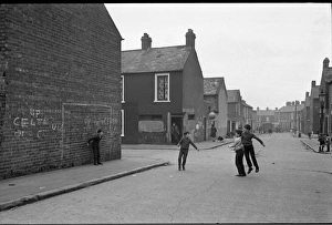 Boys playing football, Belfast, Northern Ireland Boys playing football, Belfast, Northern Ireland