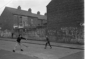 Boys playing hurling, Belfast, Northern Ireland Boys playing hurling, Belfast, Northern Ireland