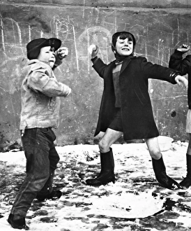 Boys snowballing in Balham, SW London Boys snowballing in Balham, SW London
