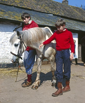 Two boys with white pony, Horner, Somerset Two boys with white pony, Horner, Somerset
