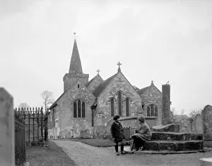 Prints of Children sitting outside the tranquil Brading Church, Isle of Wight, England. Date: early 1930s Isle Of Wight Prints: Brading Church Children, Isle of Wight Print, Early 1930s