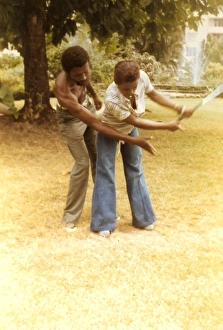 British Caribbean woman having golf lessions - Jamaica British Caribbean woman having golf lessions - Jamaica