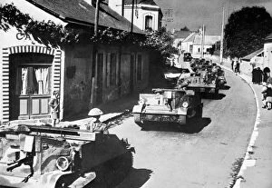 Images Dated 14th March 2012: British machine gun carriers passing through French village