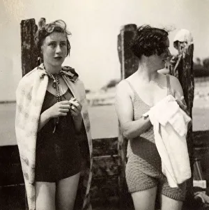 Swimsuit Gallery: British Seaside Scene - Two woemn dry off after dip in sea