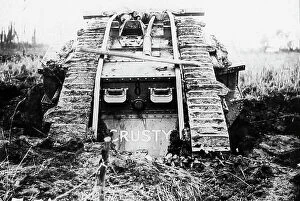 Holes Collection: A British tank going through shell holes during WW1