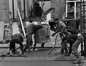 Building workers laying concrete, City of London Building workers laying concrete, City of London
