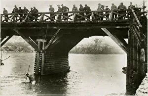 Searching Gallery: Bulgarian soldiers searching for guns in river, WW1