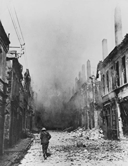 <b class=qtipBold><figcaption>Capture of Cambrai 1918</figcaption></b><br>A lone soldier in the street in Cambrai on the morning that the Germans were driven out on the Western Front in France during World War I in October 1918<br><em>© Mary Evans/Robert Hunt Collection</em> Capture of Cambrai 1918