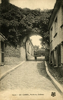 Images Dated 20th January 2016: Cassel, France - man standing under Chateau arch