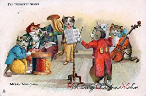 Cats playing musical instruments on a Christmas postcard Cats playing musical instruments on a Christmas postcard