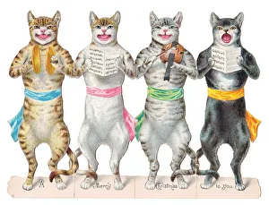 Four cats singing and playing on a cutout Christmas card Four cats singing and playing on a cutout Christmas card