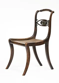 <b class=qtipBold><figcaption>Side chair</figcaption></b><br>One of a set of three chairs in imitation rosewood, with carved rope twist top rails, scrolled crossbars and woven rush seats, c.1815-1820. Date: c.1815-1820<br><em>© The Geffrye Museum of the Home / Mary Evans Picture Library</em> Side chair