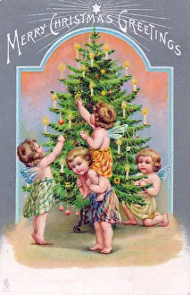 Cherubs with tree on a Christmas postcard Cherubs with tree on a Christmas postcard