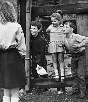 Four children playing on a Balham street, SW London Four children playing on a Balham street, SW London