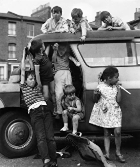 Children playing with a van in a Balham street, SW London