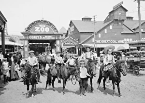 Children riding ponies at the Coney Island Amusement Park Children riding ponies at the Coney Island Amusement Park