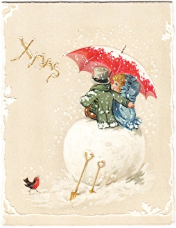 Two children sitting on large snowball on a Christmas card Two children sitting on large snowball on a Christmas card