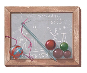 Childs slate with pen and baubles on a Christmas card Childs slate with pen and baubles on a Christmas card