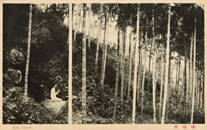 China - Shanghai - Bat Cave - Lady perching on side of hill China - Shanghai - Bat Cave - Lady perching on side of hill