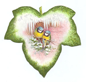Christmas card in the shape of a green leaf with birds Christmas card in the shape of a green leaf with birds