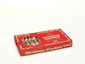 <b class=qtipBold><figcaption>Christmas crackers in box</figcaption></b><br>Cracker box printed in red and white, with a cut-out window revealing twelve unused Christmas crackers, manufactured in England c.1960-1970. Date: c.1960-1970<br><em>© The Geffrye Museum of the Home / Mary Evans Picture Library</em> Christmas crackers in box