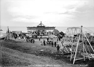 Prints of Clifton Recreation Grounds, Bangor - a scene showing a Fairground in progress with revolving Hobby-Horses and a lot of people. (Location: Northern Ireland: County Down: Bangor) Down Prints: Early 20th Century Print of Bangor Fairground Scene