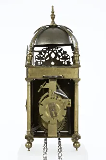 <b class=qtipBold><figcaption>Clock, reverse</figcaption></b><br>Brass and metal lantern clock on four ball feet, made by Robert Robinson in Lothbury, City of London, c.1660-1670. Date: 1660-1670<br><em>© The Geffrye Museum of the Home / Mary Evans Picture Library</em> Clock, reverse