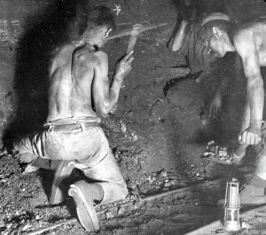 Prints of Two miners, stripped to the waist, working at the coalface in a coal seam in South Wales Industrial Prints: Coal Mining Print: Miners at the Coalface, South Wales