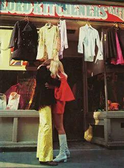 Couple kissing outside Carnaby Street boutique