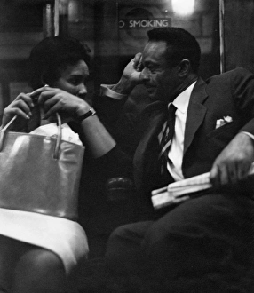 Couple on a London underground train Couple on a London underground train