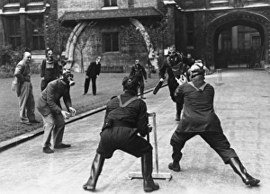 <b class=qtipBold><figcaption>Cricket match in gasmasks</figcaption></b><br>Public Record Office staff stage a cricket match in gasmasks during WWII Date: 1939-1945<br><em>© Mary Evans / National Archives</em> Cricket match in gasmasks