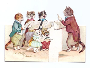 Cutout Christmas card with carol singing cats Cutout Christmas card with carol singing cats