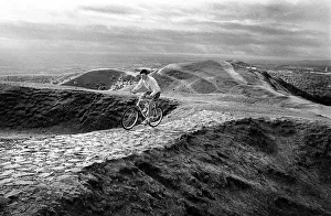 Cyclist on the Malvern Hills above Droitwich, Worcs Cyclist on the Malvern Hills above Droitwich, Worcs