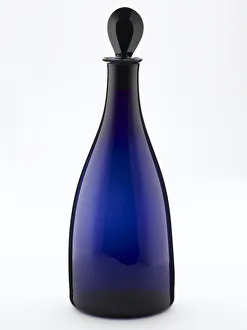 <b class=qtipBold><figcaption>Decanter</figcaption></b><br>Decanter of tapered form made from blown and bevelled blue glass, with a pear-shaped stopper, one of a pair made in England c.1790. Date: c.1790<br><em>© The Geffrye Museum of the Home / Mary Evans Picture Library</em> Decanter