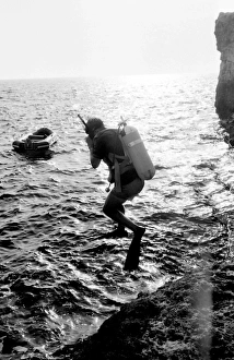 Inflatable Gallery: Diver jumping into the sea off the coast of Malta