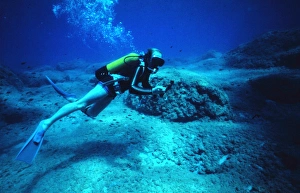 Diver on the seabed off the coast of Malta Diver on the seabed off the coast of Malta