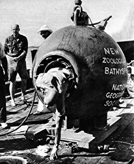 Iron Gallery: Dr. Beebe climbing out of his bathysphere, August 1934