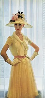 <b class=qtipBold><figcaption>Dress by Pierre Balmain, 1960</figcaption></b><br>A dress by Pierre Balmain in pale yellow silk chiffon with a matching hat trimmed with roses and white lilac. Date: 1960<br><em>© Illustrated London News Ltd/Mary Evans</em> Dress by Pierre Balmain, 1960
