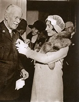 Duchess of York pins a star on breast of Prebendary Carlise Duchess of York pins a star on breast of Prebendary Carlise