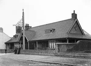 Prints of Dunleath Arms Hotel, Ballywalter - an oblique front view of the hotel with three men outside. (Location: Northern Ireland; County Down; Ballywalter). Date: circa early 1900s Down Prints: Early 20th Century Print of Dunleath Arms Hotel, Ballywalter