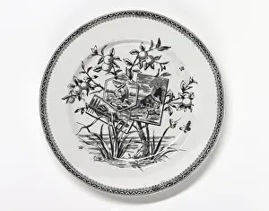 <b class=qtipBold><figcaption>Plate</figcaption></b><br>One of three earthenware plates with a black and white transfer printed underglaze design in the centre and a zig-zag border around the rim, the pattern name is 'Pomona'. Manufactured in Stoke on Trent either by Worthington and Harrop, or Wood and Hulme, dating from between 1856 and 1885. Date: 1856-1885<br><em>© The Geffrye Museum of the Home / Mary Evans Picture Library</em> Plate