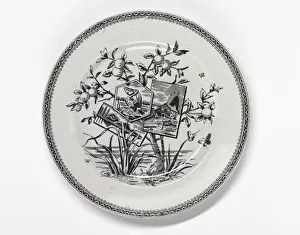<b class=qtipBold><figcaption>Plate</figcaption></b><br>One of three earthenware plates with a black and white transfer printed underglaze design in the centre and a zig-zag border around the rim, the pattern name is 'Pomona'. Manufactured in Stoke on Trent either by Worthington and Harrop, or Wood and Hulme, dating from between 1856 and 1885. Date: 1856-1885<br><em>© The Geffrye Museum of the Home / Mary Evans Picture Library</em> Plate