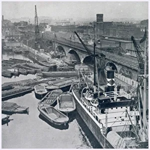 East London and Regent's Canal Dock in Limehouse, showing barges waiting for access to East London and Regent's Canal Dock in Limehouse, showing barges waiting for access to