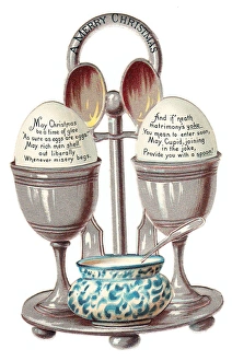 Eggcup stand with two eggs on a cutout Christmas card Eggcup stand with two eggs on a cutout Christmas card