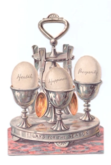 Eggcup stand with eggs on a cutout Christmas card Eggcup stand with eggs on a cutout Christmas card