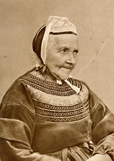 Elderly woman in traditional costume, France Elderly woman in traditional costume, France
