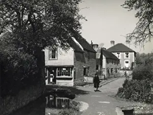 Prints of The quaint old village of Loose, near Maidstone, Kent, showing some of the weather- boarded houses and the stream that flows through the village. Date: 1940s Loose Prints: Loose Village Print, Kent, 1940s