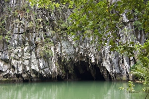 Entry to a cave that features a limestone karst Entry to a cave that features a limestone karst