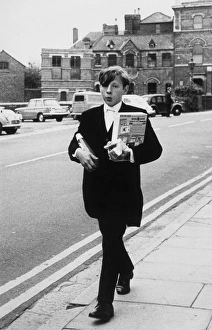 <b class=qtipBold><figcaption>Eton Boy in Street 1950S</figcaption></b><br>An Eton schoolboy going nonchalantly into town. Date: 1950s<br><em>© Mary Evans Picture Library/HENRY GRANT</em> Eton Boy in Street 1950S